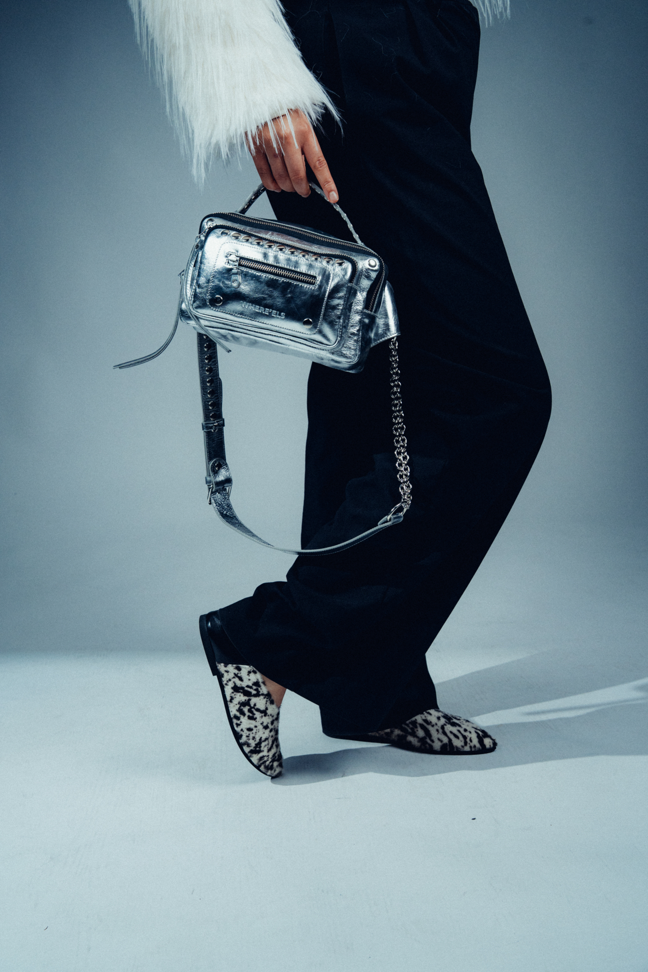 Accessory campaign still with metallic bag