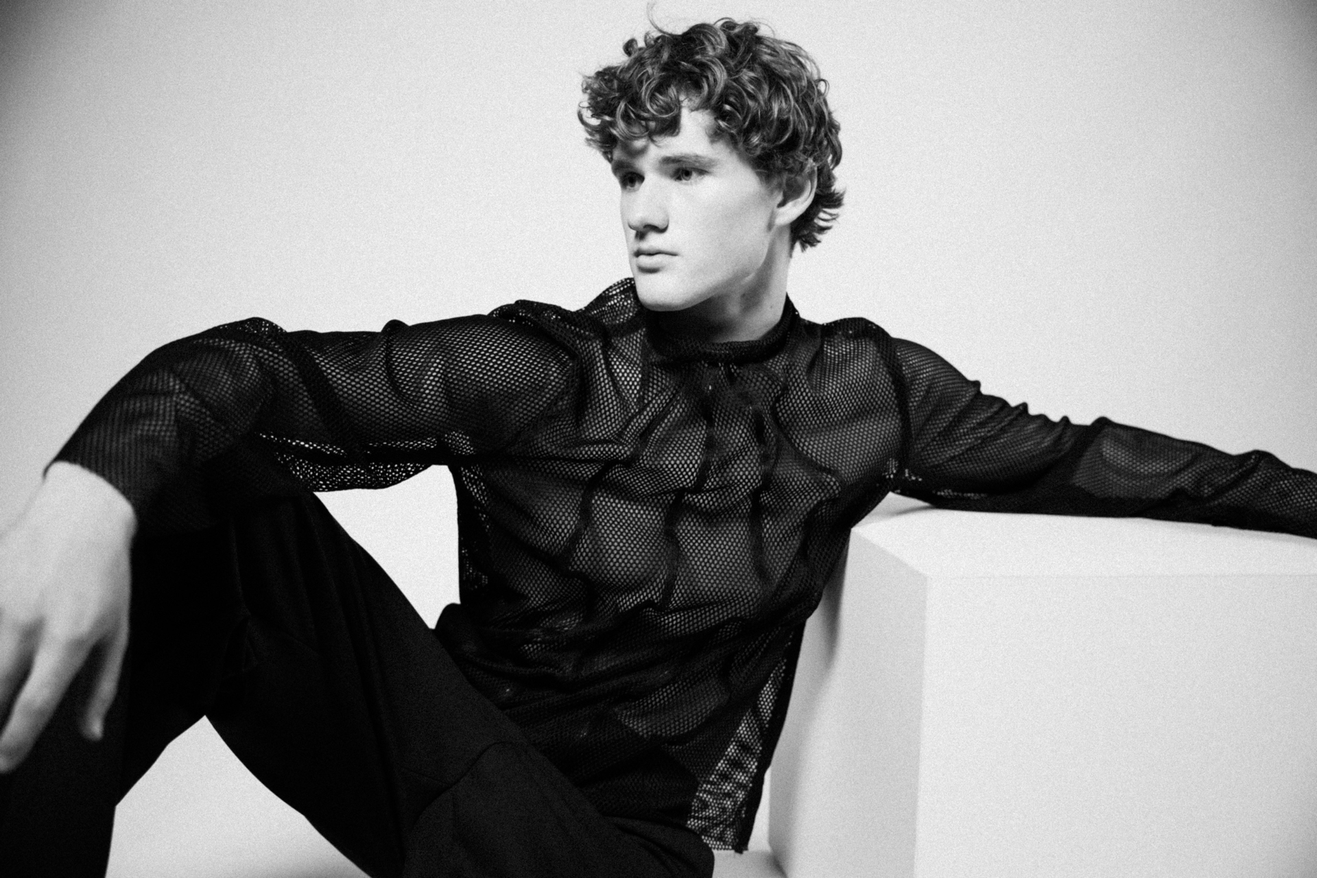 Studio editorial in black mesh top